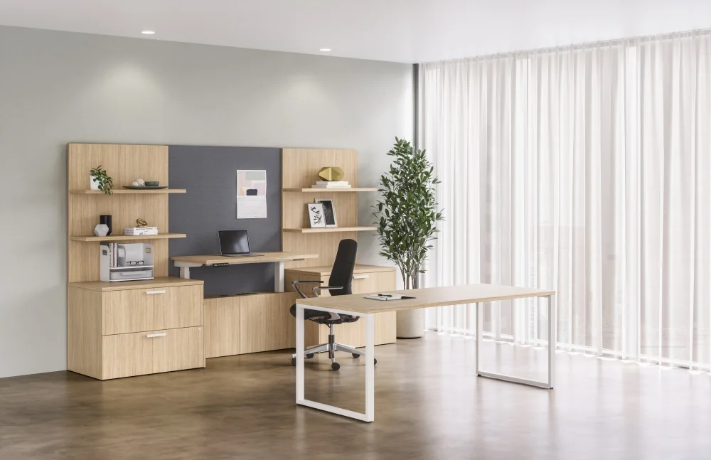 Light wood desk and storage with an ergonomic chair in a private office